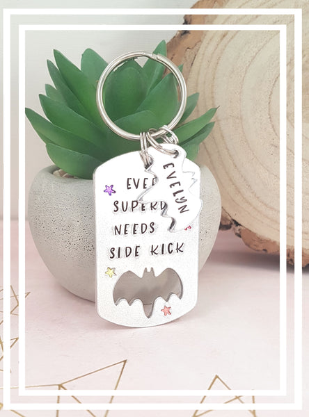 This keyring is hand stamped with the phrase 'Every Superdad needs a sidekick'