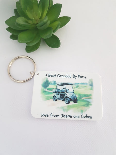 Keychain with golf cart design and text on a white background, best grandad by par keyring, best dad by par, gift for grandad , keyring for dad, fathers day gift, cheap golf keyring, cheap gifts for grandad