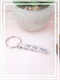 The 3D hand-stamped keyring features four sides with the heartfelt message, "I love you more, The end. I win." It is embellished with a stamped heart, where we can personalise it with an initial before the heart upon request.