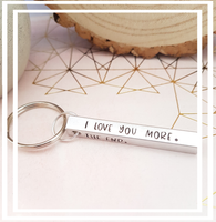 The 3D hand-stamped keyring features four sides with the heartfelt message, "I love you more, The end. I win." It is embellished with a stamped heart, where we can personalise it with an initial before the heart upon request.