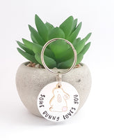 Hand stamped 'some bunny loves you' keyring