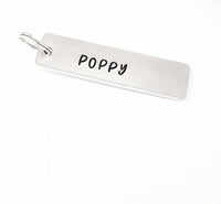 'This Mummy is loved by' hand stamped flower keyring